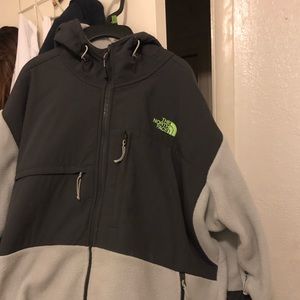 Grey north face with green north face